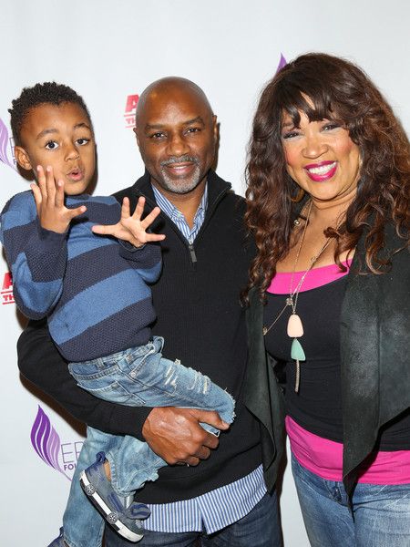 Kym Whitley poses a picture with Rodney Van Johnson and their son.